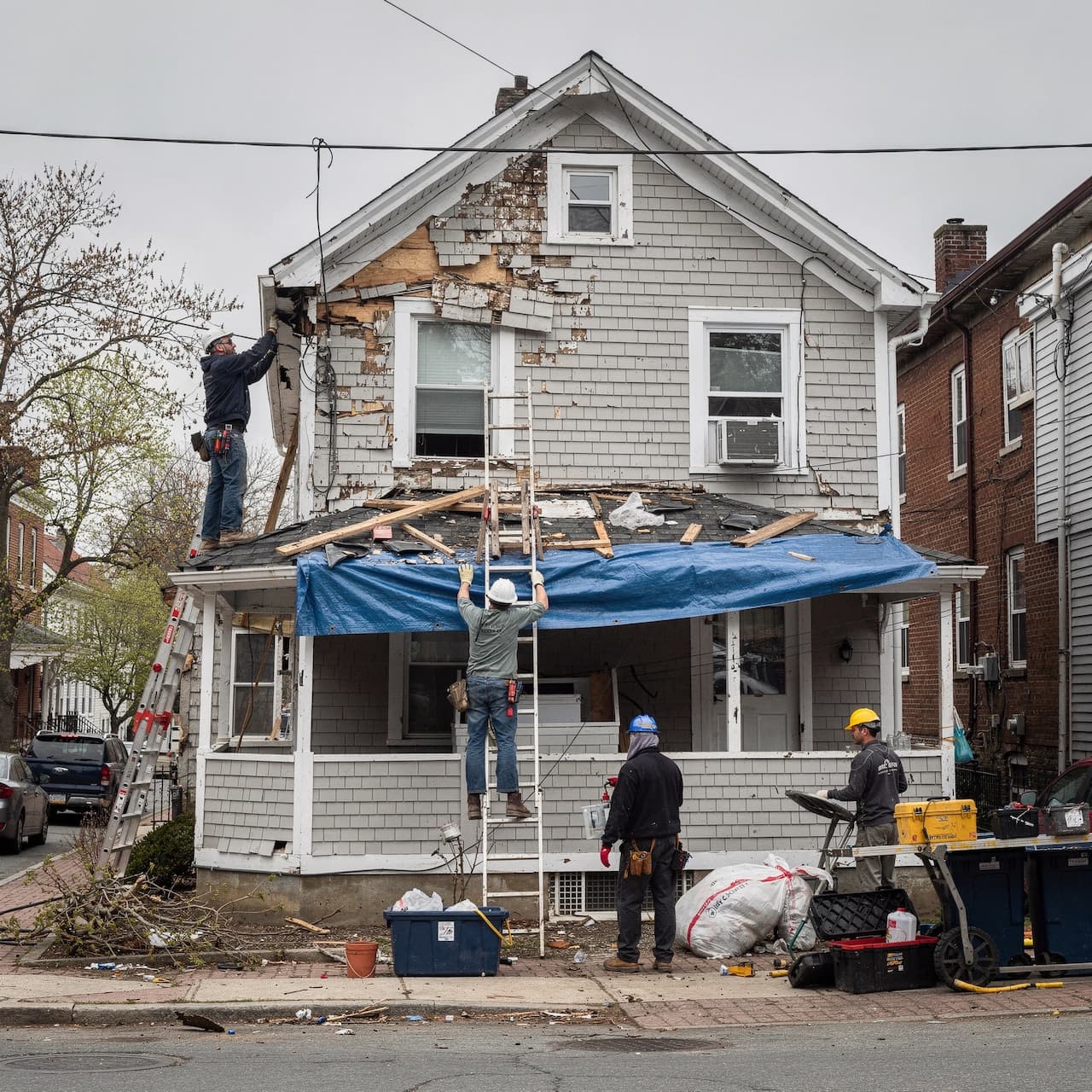 Storm restoration services team working on a damaged property in Boston