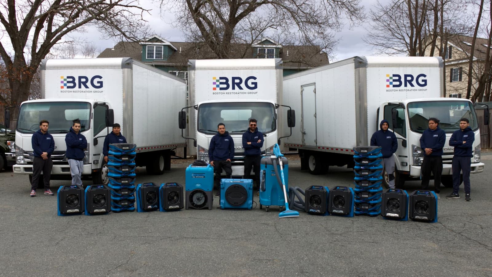 Boston Restoration Group team with BRG vehicles and restoration drying equipment