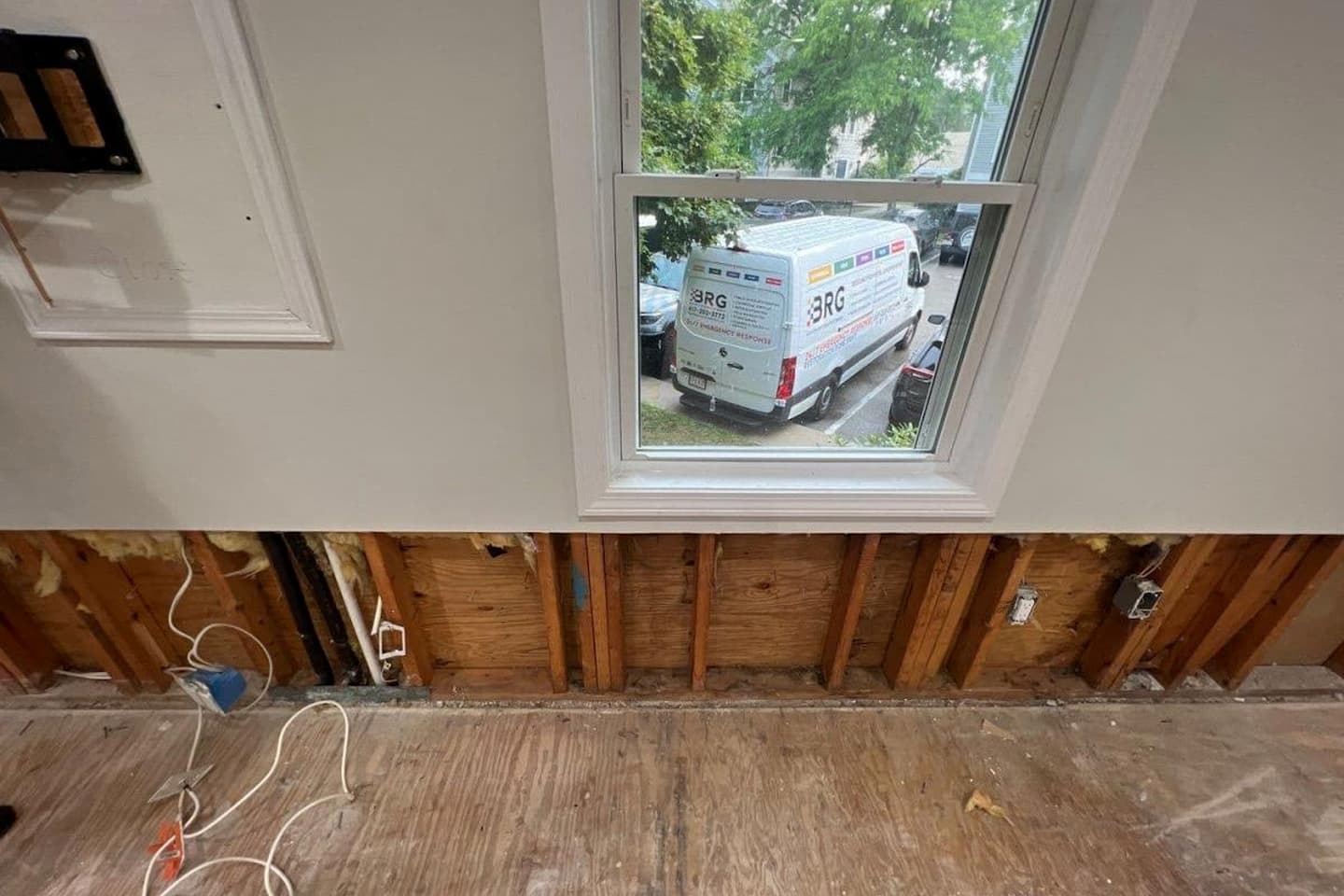 BRG service van parked outside a residential restoration project