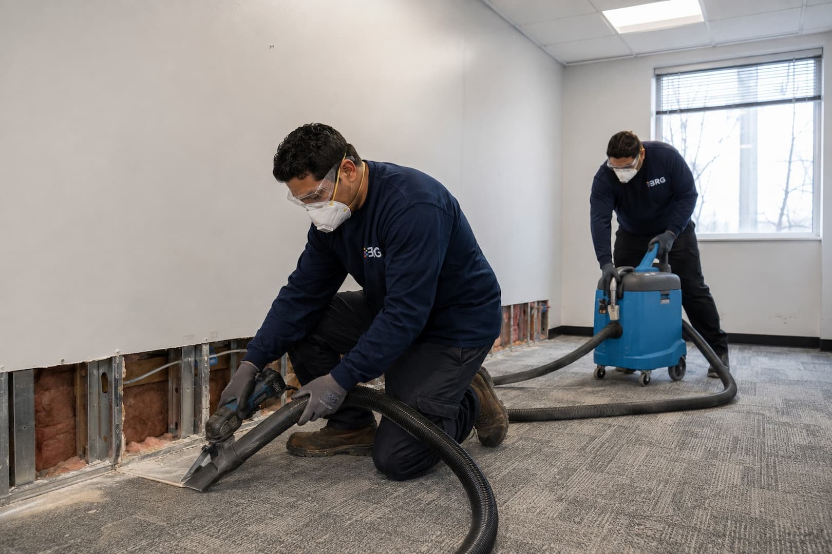 Controlled removal of mold-affected drywall in a commercial room