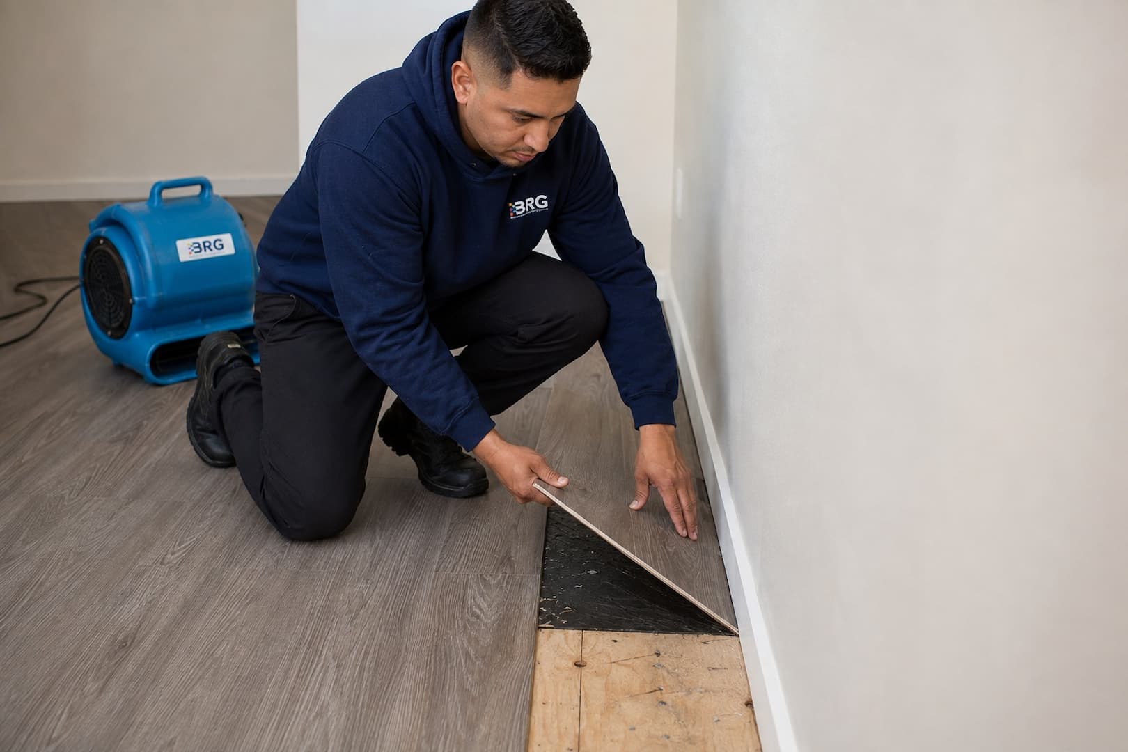 Laminate edge swelling and subfloor access being evaluated